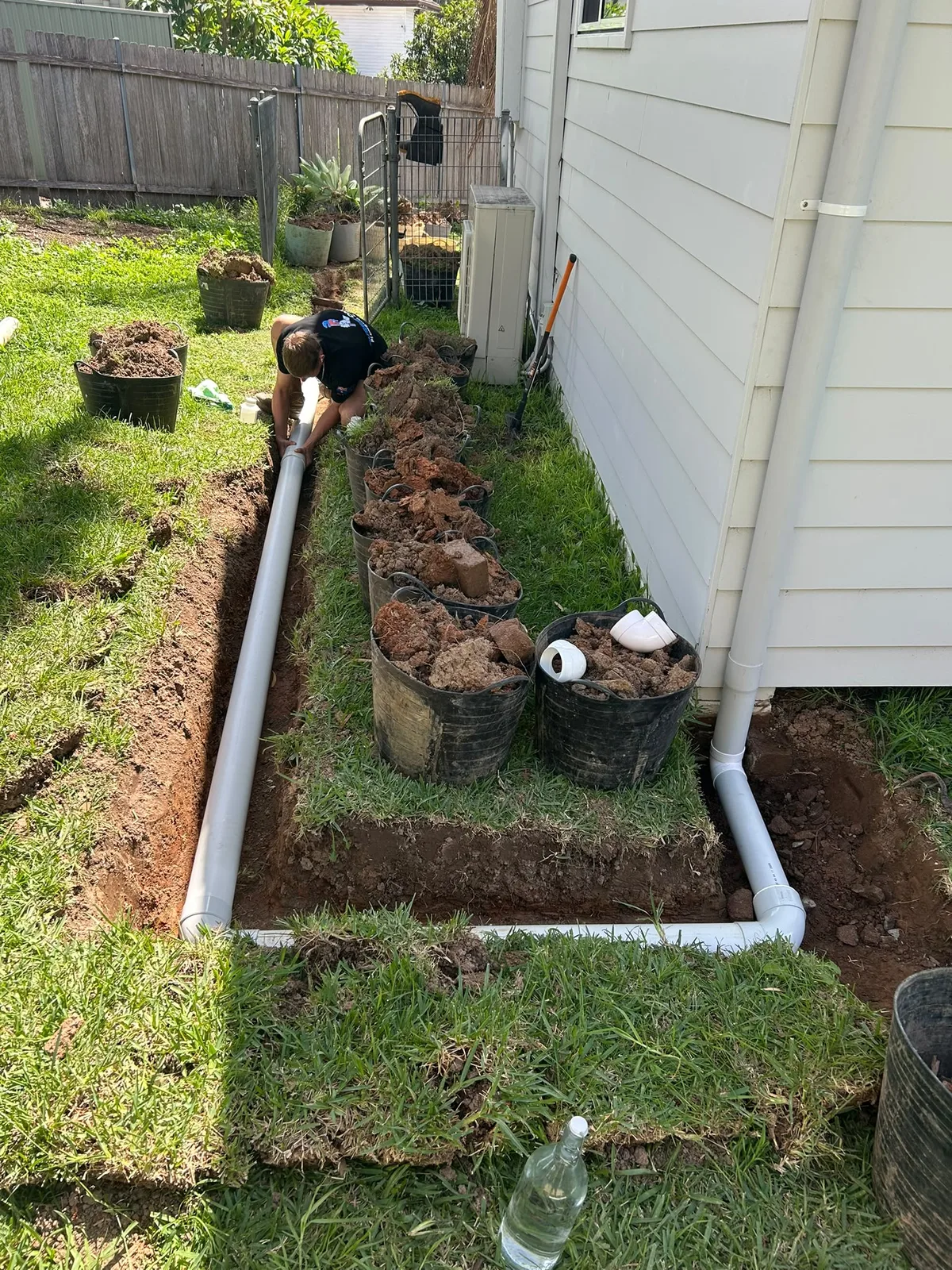 A new drainage pipe laid and levelled in an open trench